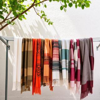 Scarves drying on rack after test